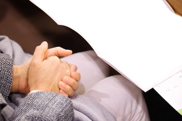 A close-up, empathetic image of hands exchanging paperwork during a consultation about bereavement financial support.