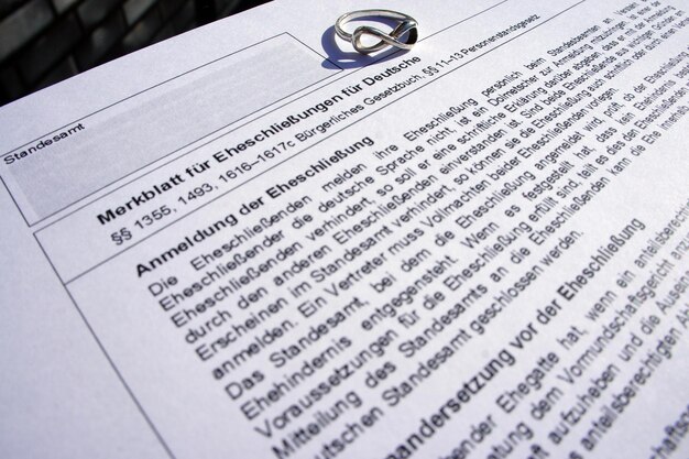 A close-up shot of a document with the official UK government logo, focusing on amended sections related to National Insurance Contributions. The image should highlight changes in text and formatting.