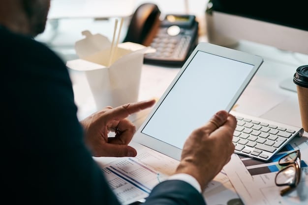 An image of a government website page detailing information about the Council Tax Reduction scheme, with a person pointing at key details using a stylus on a tablet.