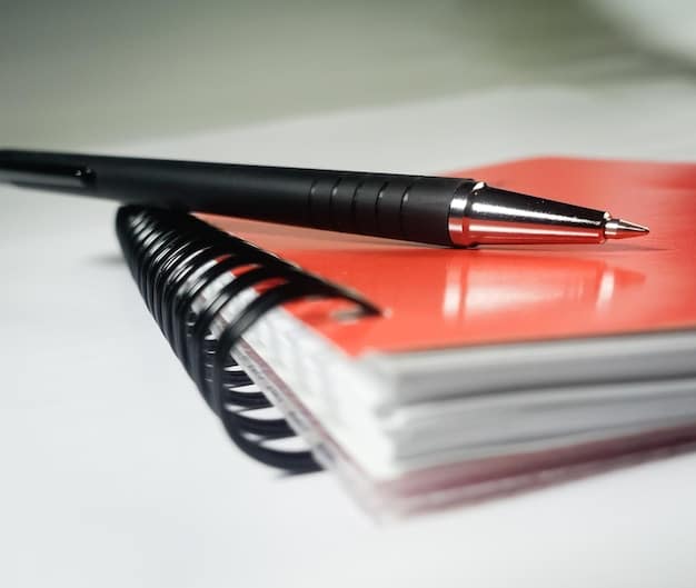 A close-up shot of official documents related to benefits, with a pen resting on top. The documents are slightly blurred, but the words 