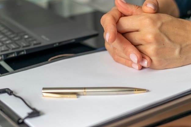 A close-up shot of a hand signing a document, representing the application process for Jobseeker's Allowance.