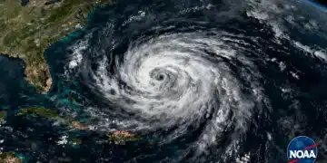 Satellite view of a powerful hurricane over the Atlantic, indicating NOAA's 2026 forecast